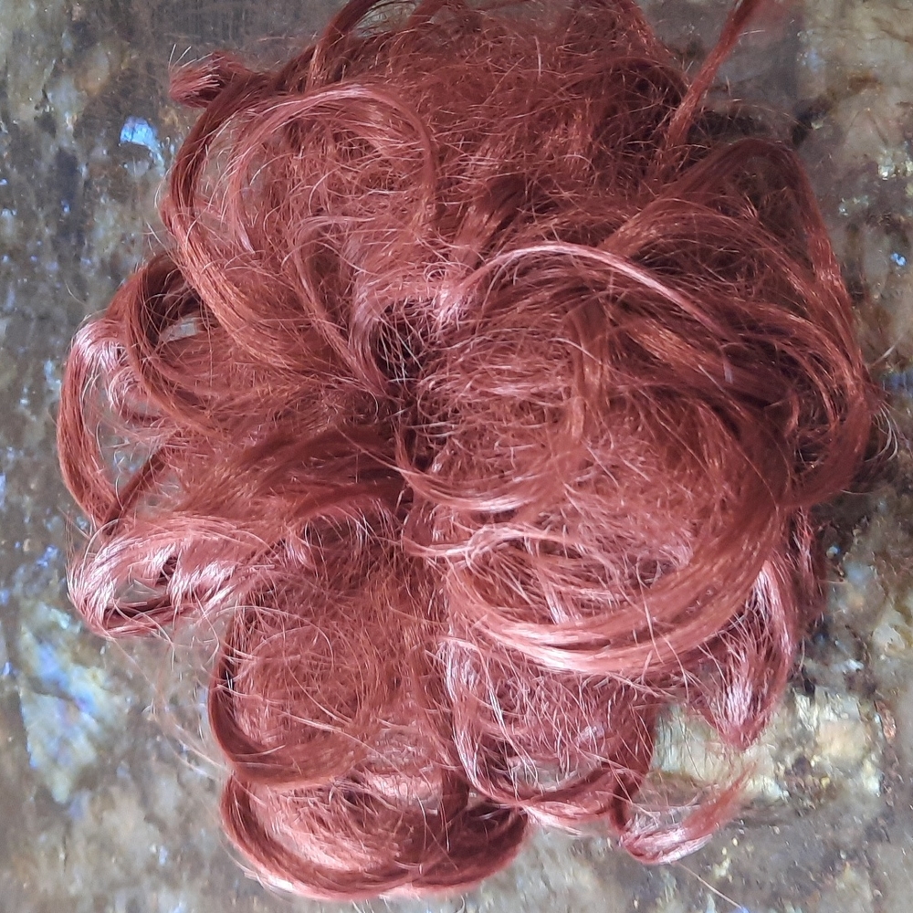 Curly messy auburn bun